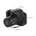 Black plastic 16-megapixel digital camera with dimensions labeled and a lens cap attached by a lanyard.