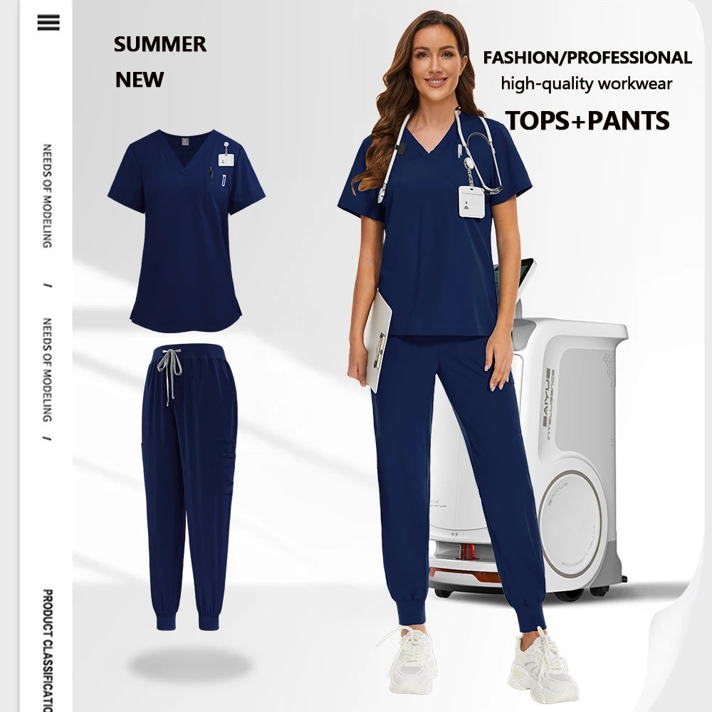 Model wearing a navy blue scrub set with a V-neck top, utility pockets and cuffed trousers with a drawstring waist.