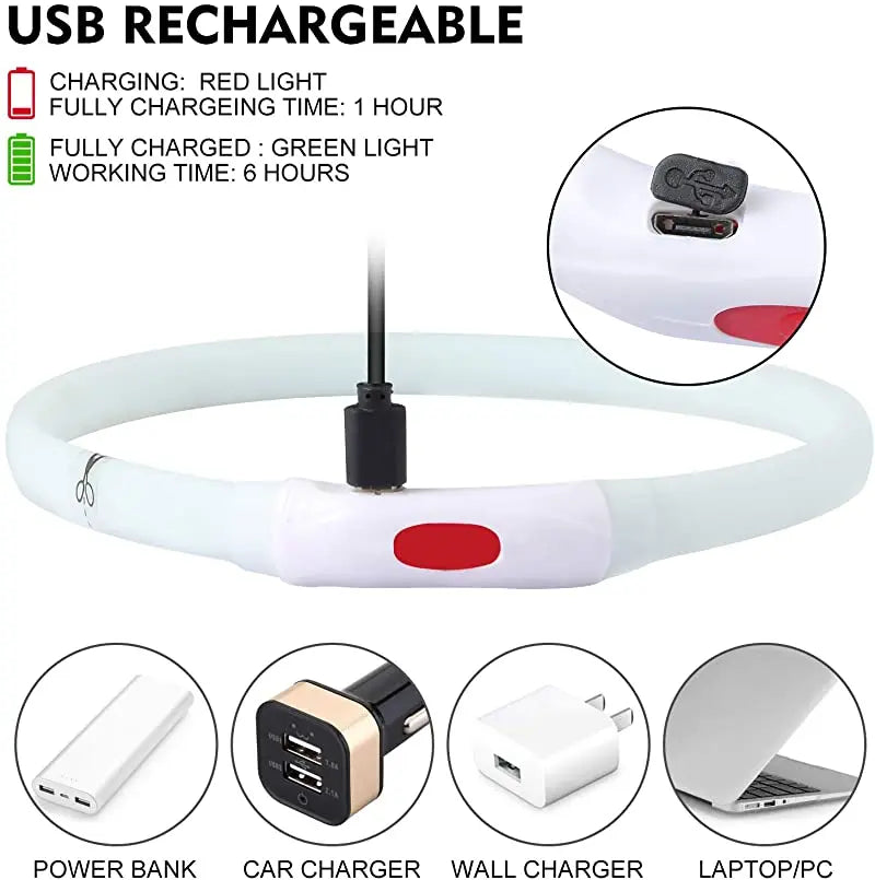 White silicone LED dog collar charging via USB, with a red power button and cut-to-size indicator.