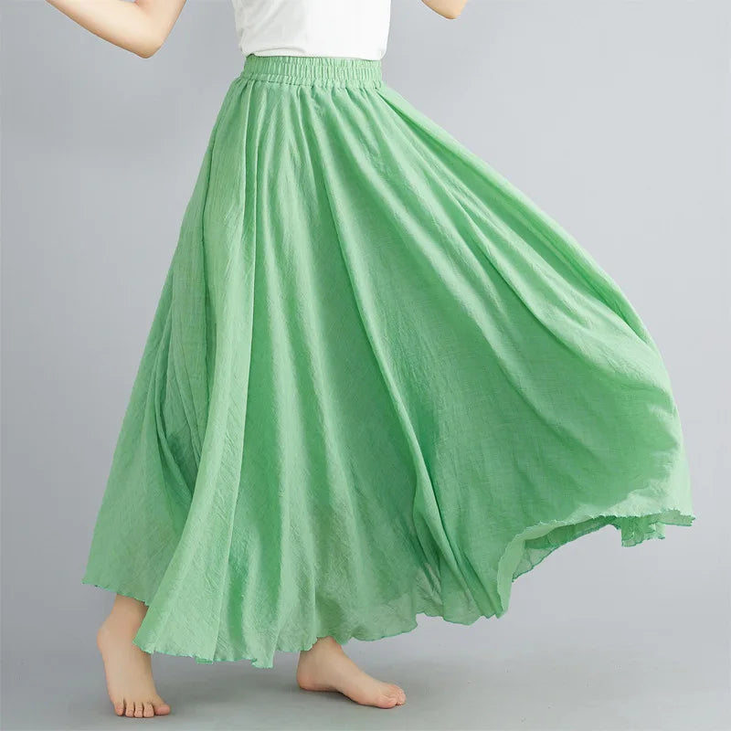 Flowing apple green maxi skirt with a comfortable elasticated waistband and textured fabric finish.