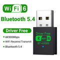 Compact black USB adapter with WiFi 6 and Bluetooth 5.4 support, featuring "Driver Free" and AX900 speed branding.