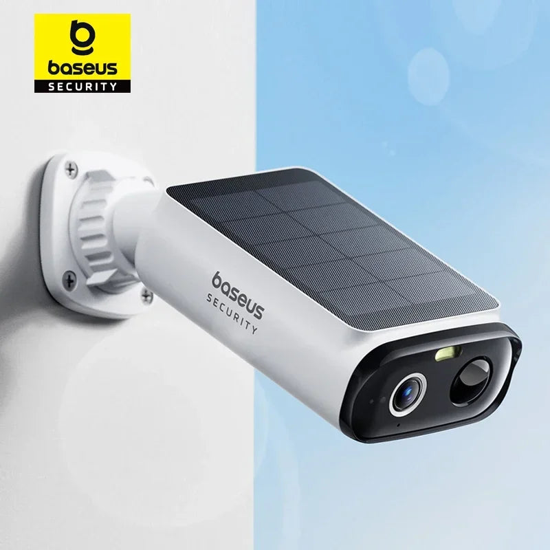 White Baseus Security camera mounted on a wall, featuring a built-in solar panel on top.
