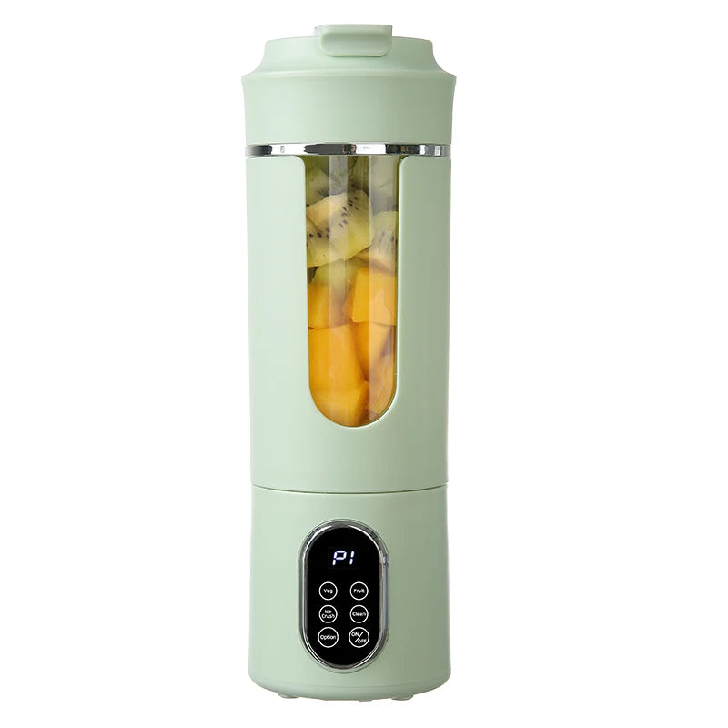 Light green portable blender with a clear center window showing chopped fruit and a digital control panel base.