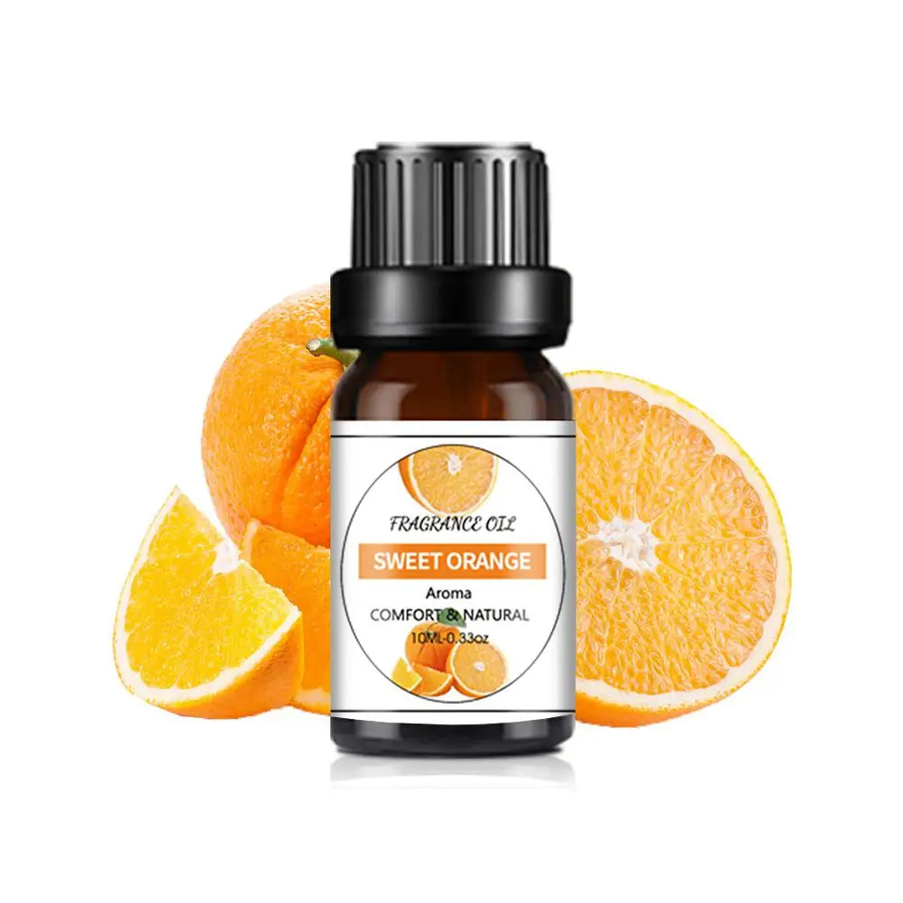 10ml amber glass bottle of Sweet Orange fragrance oil with a black cap, displayed in front of fresh orange slices.