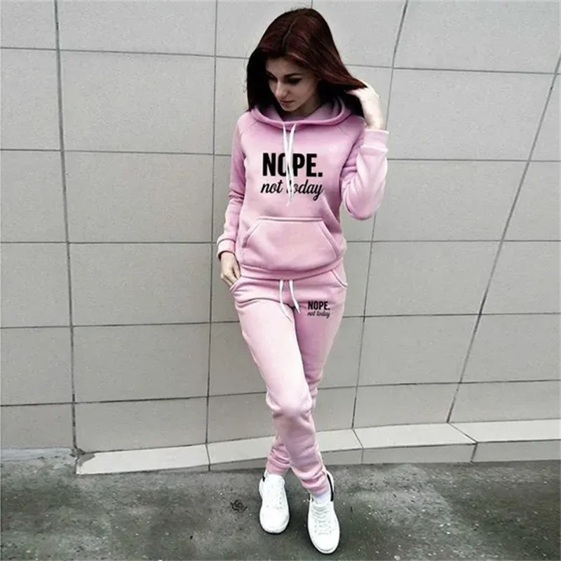 Light pink tracksuit with hooded top and joggers, featuring "NOPE. not today" slogan in black text.