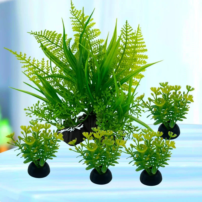 A set of five artificial aquarium plants with vibrant green foliage in black weighted bases.
