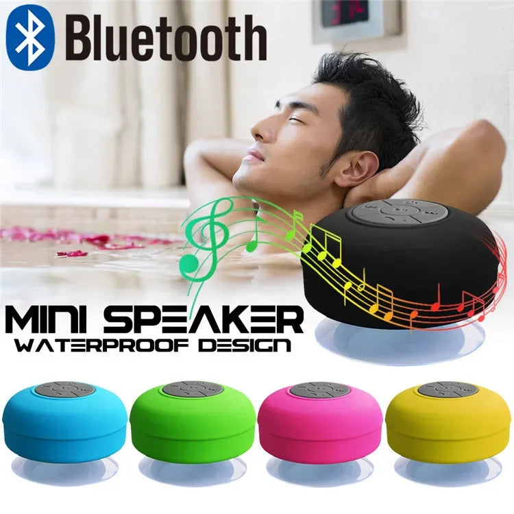 Small, round, colourful waterproof Bluetooth speakers with suction cups, shown in a range of bright matte finishes.
