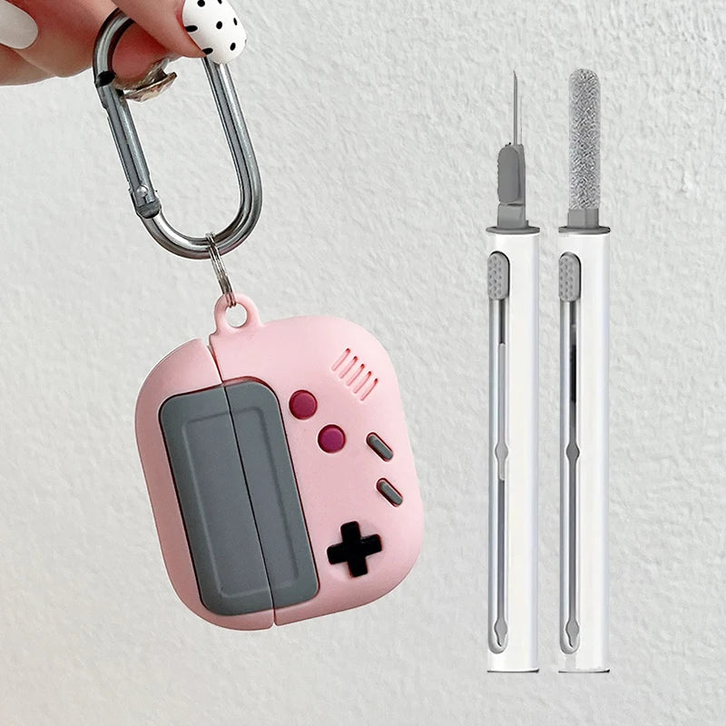 Pink retro game controller silicone case for AirPods with carabiner and cleaning kit.