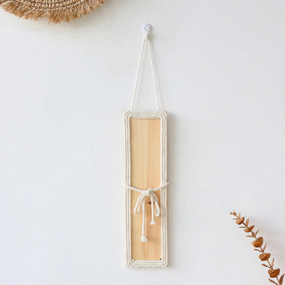 Bohemian rectangular wall decor featuring a light wood panel, cream rope border and a decorative centre bow.