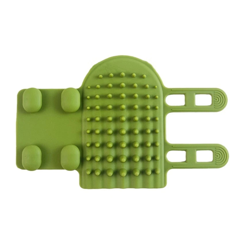 Olive green silicone shower brush with a textured scrub surface, flat palm grips, and two adjustable hand straps.