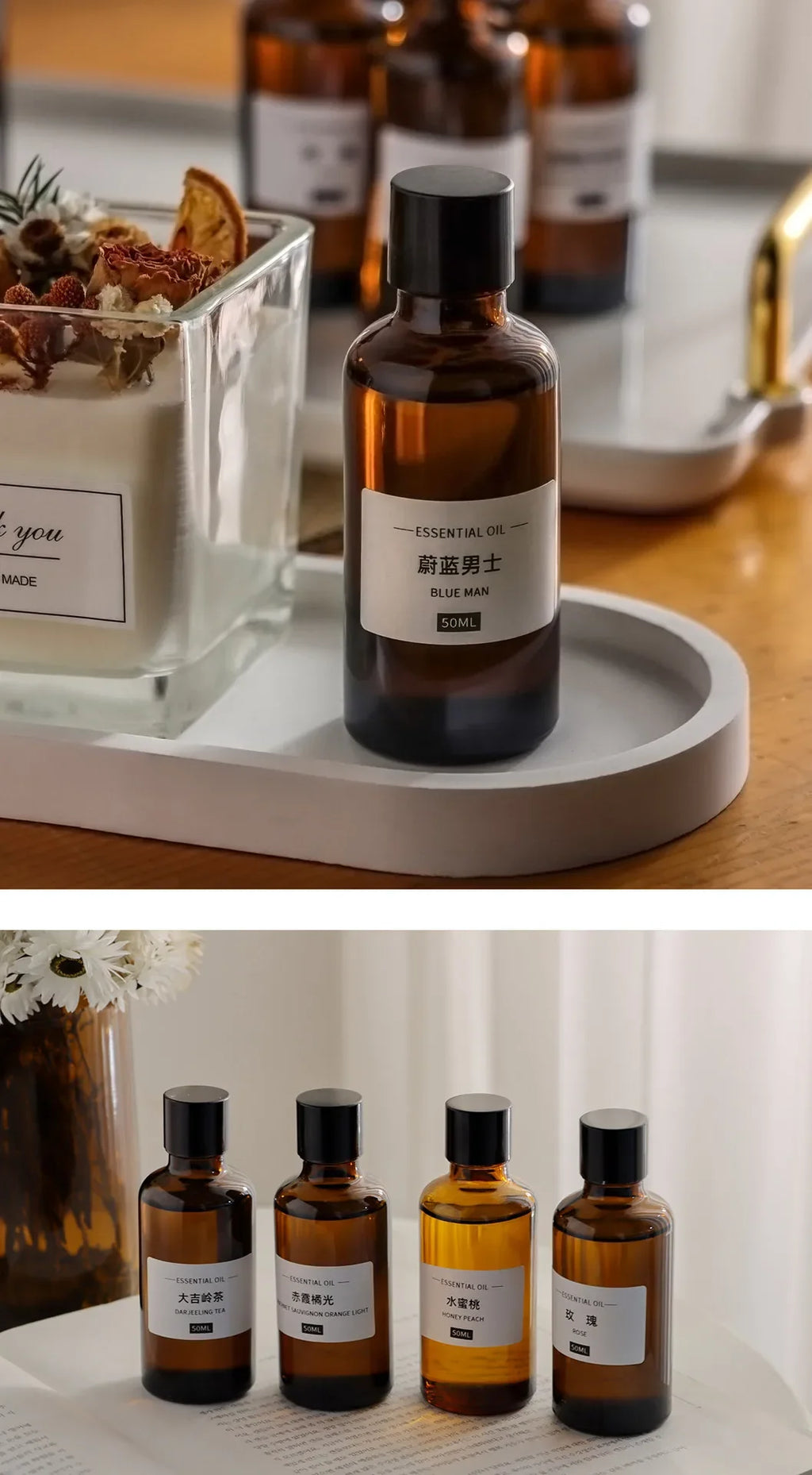 Amber glass essential oil bottles with black caps and white labels, arranged on a modern tray and white surface.