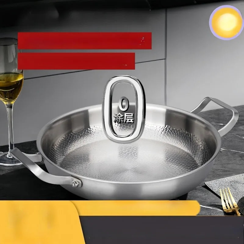 Stainless steel pan with double handles and textured interior on a dark countertop.