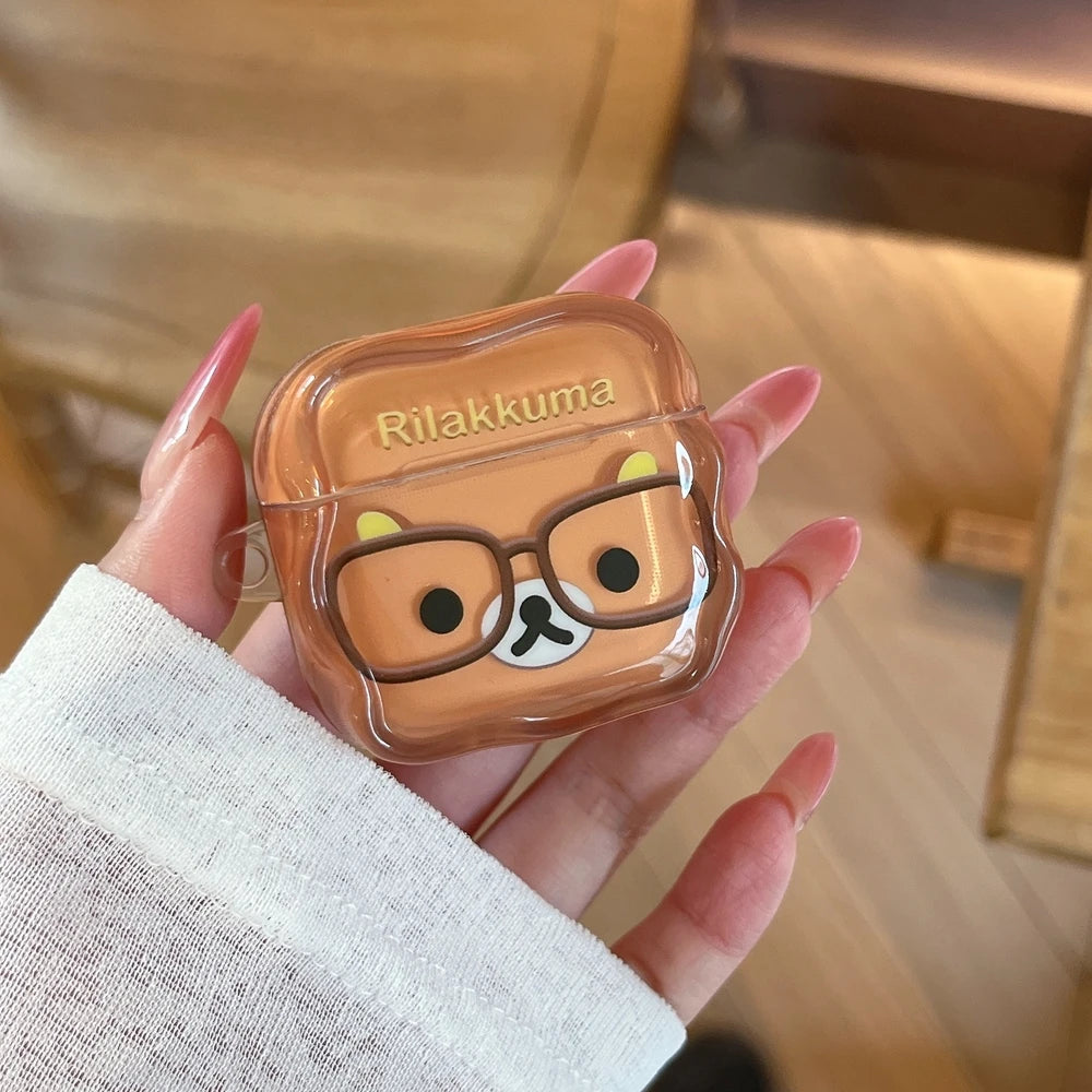Clear Rilakkuma AirPods case with brown character design. Durable protective cover for AirPods.
