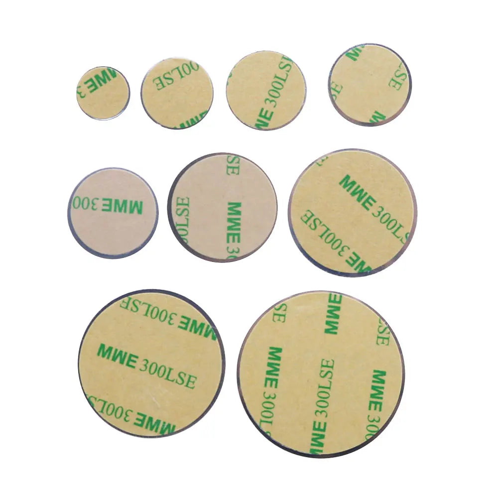 Nine circular adhesive pads of varying sizes, with tan backing paper featuring green printed text.