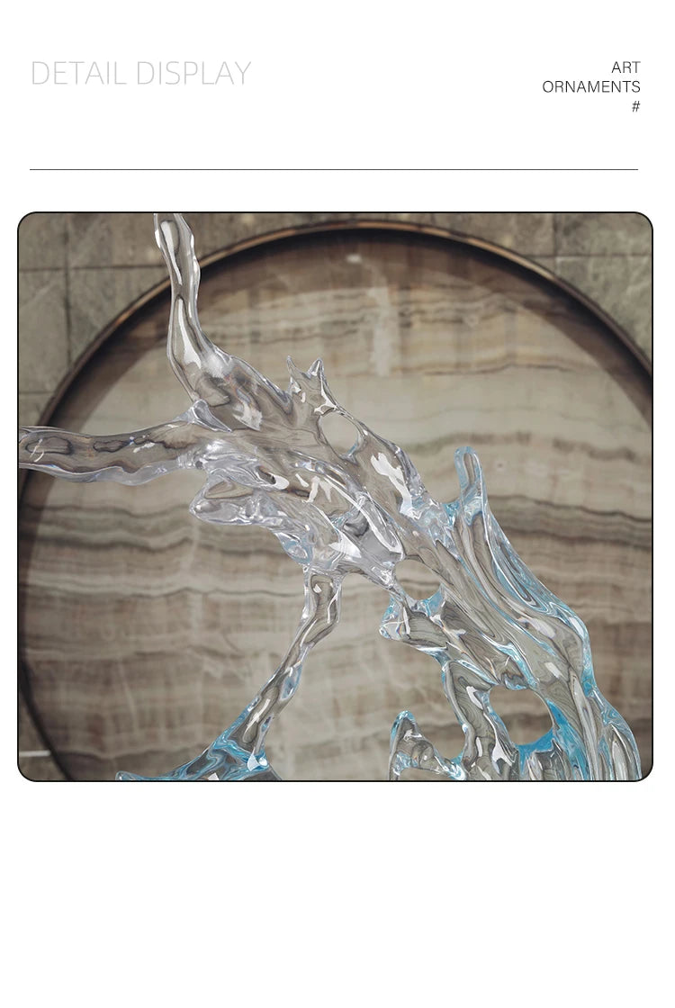 A modern, transparent resin ornament with a fluid, water-splash design, set against a circular marble-effect background.
