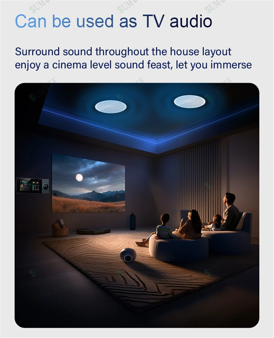 Black 7-inch wall-mounted touch control panel in a modern cinema room with recessed ceiling speakers.