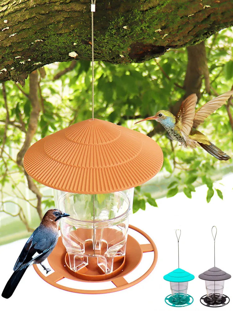 Hanging bird feeder with a textured, hat-shaped roof, clear reservoir, and circular tray. Available in three colors.