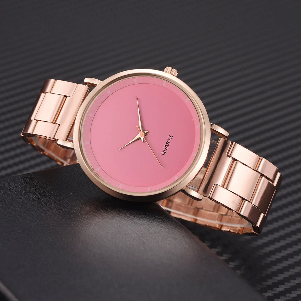 Ladies' rose gold stainless steel watch with a minimalist pink dial and matching metallic link strap.