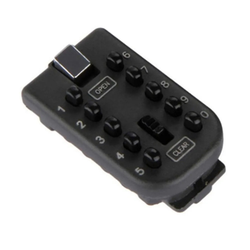 Black plastic wall-mounted key lock box with a push-button numeric keypad, OPEN button, and CLEAR button.