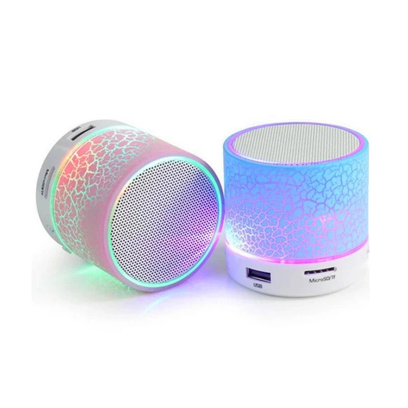 Two portable, cylindrical mini speakers with colourful cracked-effect LED patterns, USB ports and silver mesh tops.