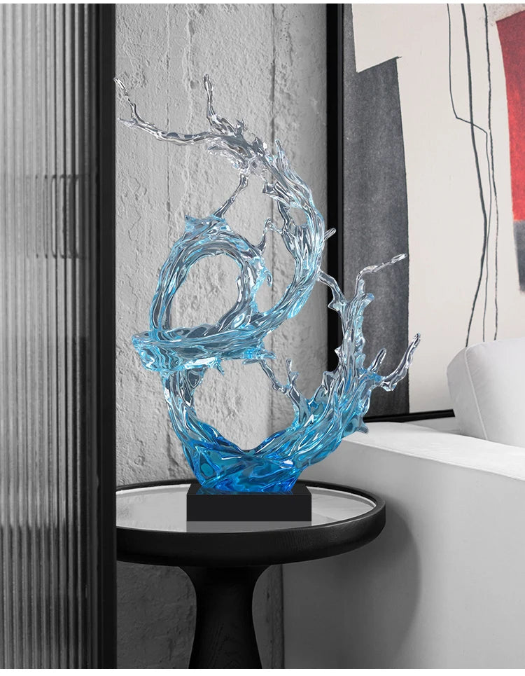 Modern sculptural ornament featuring a blue-to-clear resin wave design on a black base, styled for a contemporary home.