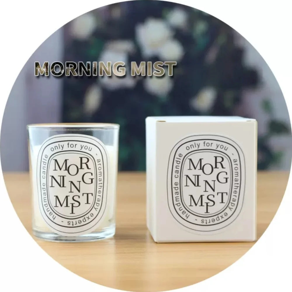 Morning Mist scented aromatherapy candle in a glass jar, next to its matching white gift box.