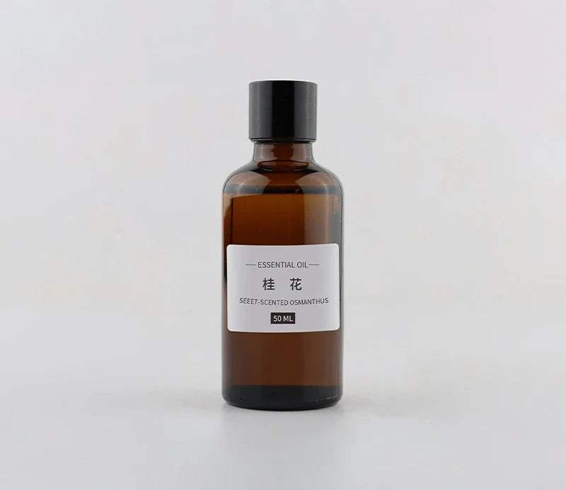 50ml brown glass bottle of Osmanthus essential oil with a black screw cap and white minimalist label.