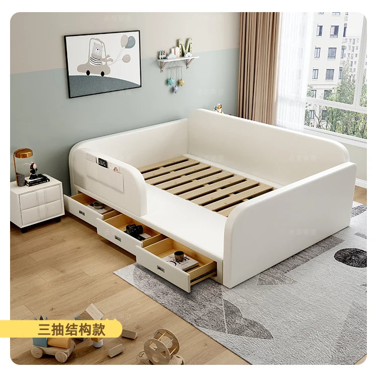 Modern white upholstered toddler storage bed with three pull-out drawers and a protective surround in a bedroom setting.