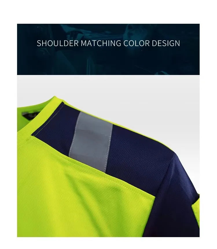 Close-up of a neon yellow hi-vis work shirt featuring contrasting dark blue shoulder panels and reflective tape.