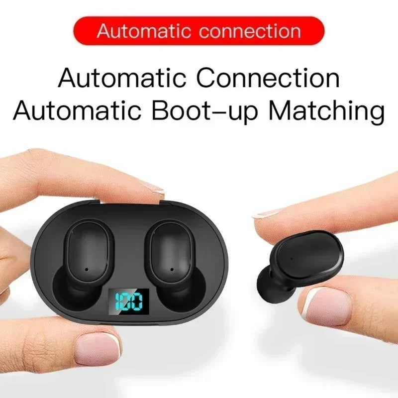 Black wireless earbuds and a charging case with a digital battery display held between fingers.