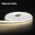 Coiled smart LED neon strip light glowing with a natural white light against a dark background.