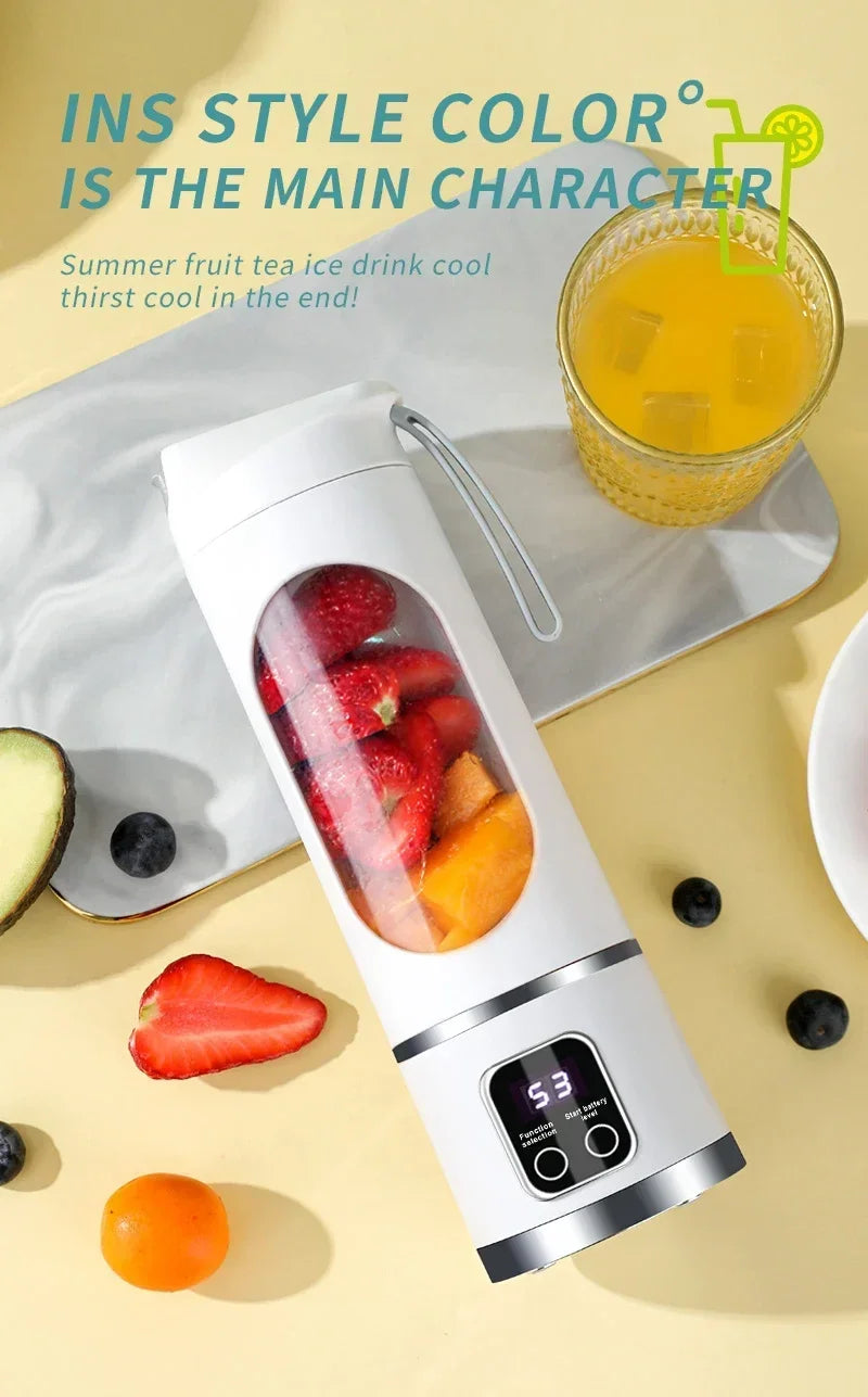 White portable personal blender with a clear window filled with fruit and a digital LED display at the base.