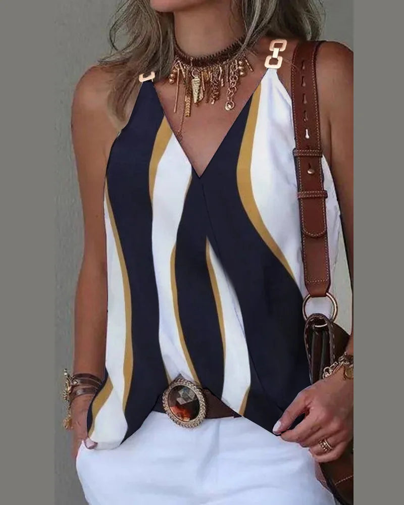 Women's V-neck sleeveless top in white, navy, and mustard vertical wavy stripes with gold-tone metal strap detail.