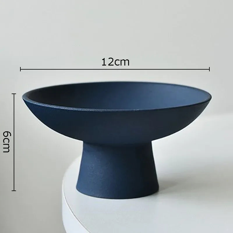 Modern dark blue pedestal bowl with a matte finish, measuring 12cm wide and 6cm high. Perfect for stylish decor.