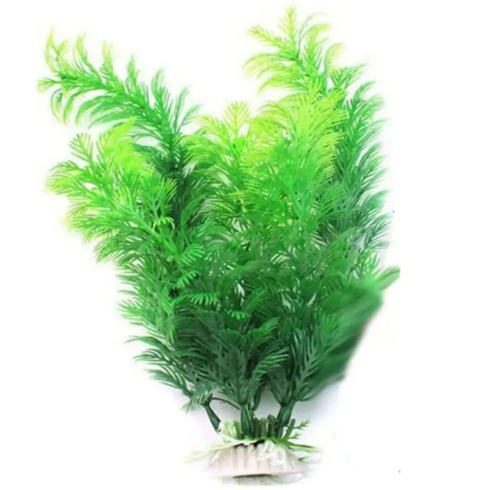 Artificial green aquarium plant with feathery, bright green plastic fronds attached to a small, weighted white base.