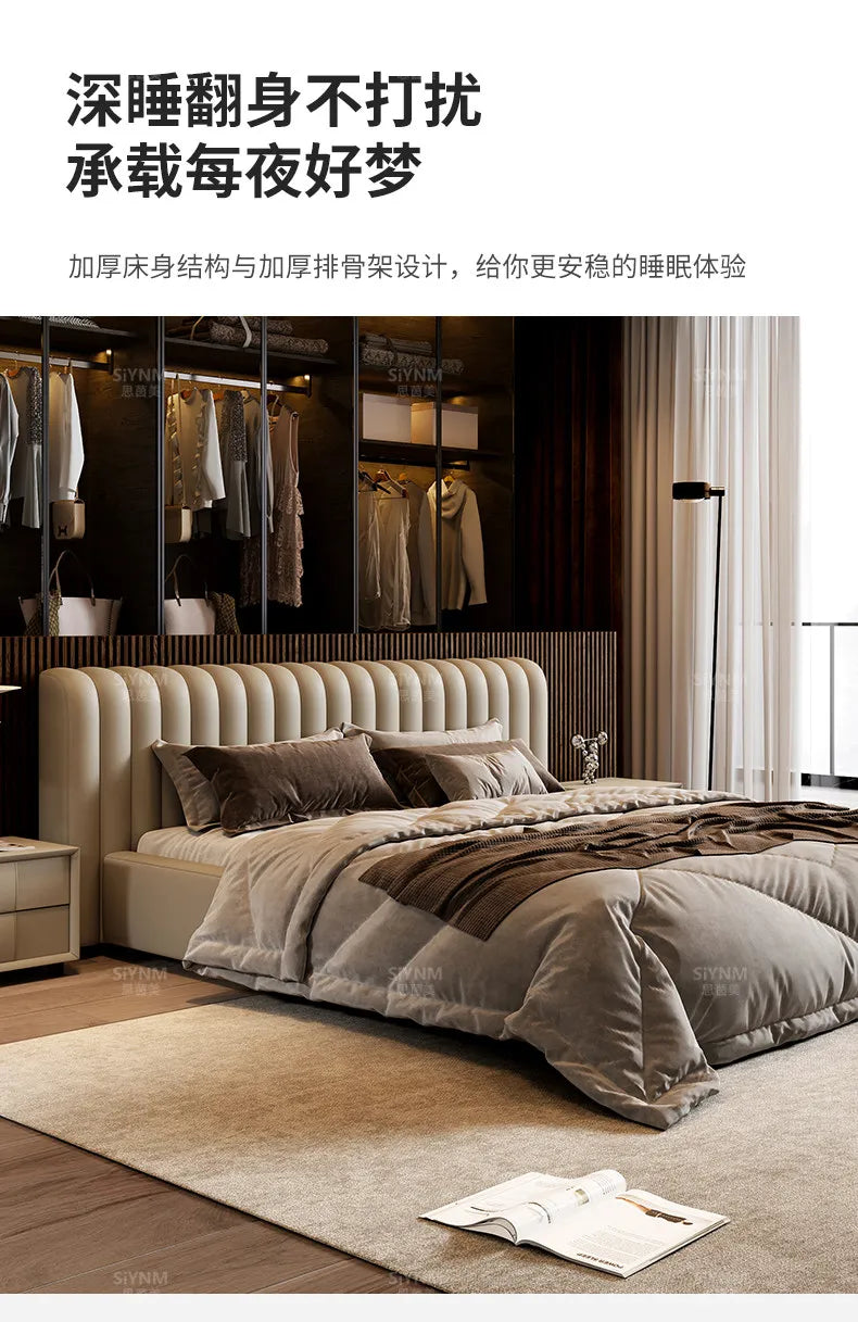 Modern cream storage bed frame with a vertical-channelled headboard, styled in a minimalist bedroom.