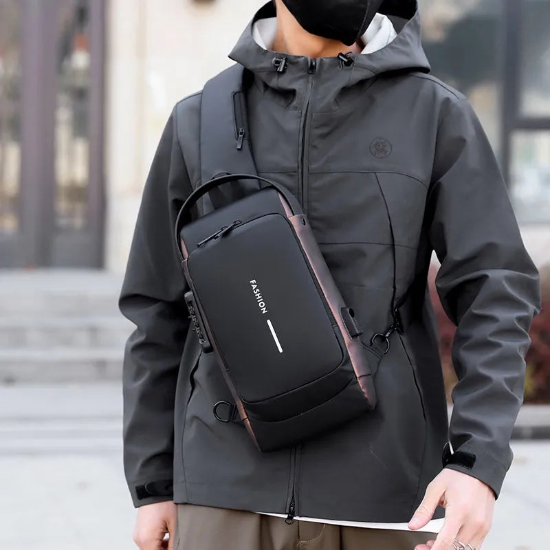 Black anti-theft crossbody chest bag with integrated password lock and USB port, worn by a person in a grey jacket.