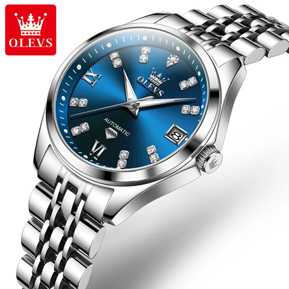 Elegant women's stainless steel automatic watch with a blue dial, crystal hour markers, and a date window.
