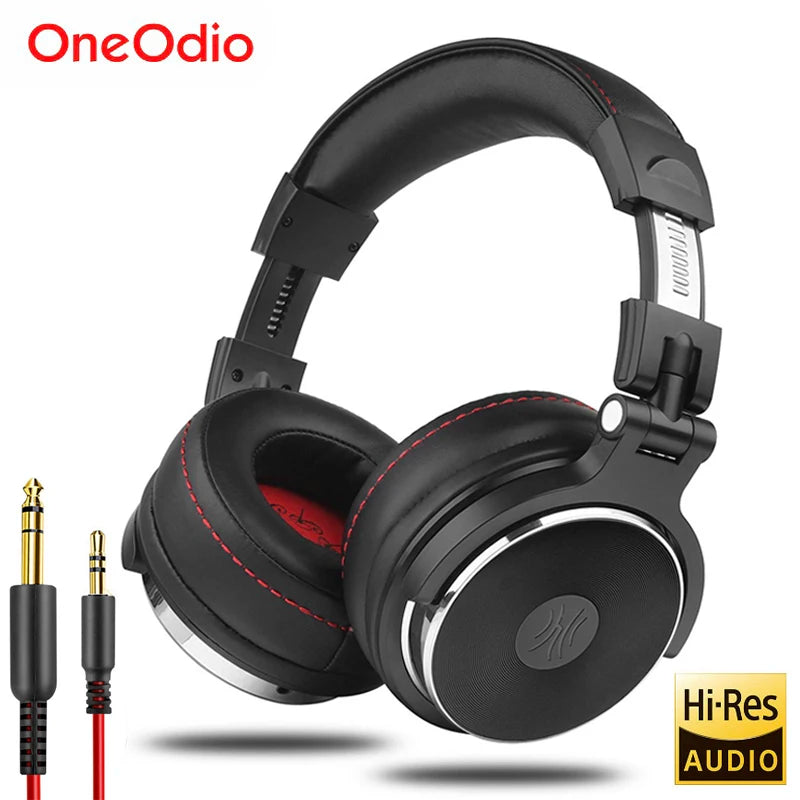 Black over-ear studio headphones with red stitching detail and two detachable audio cables.