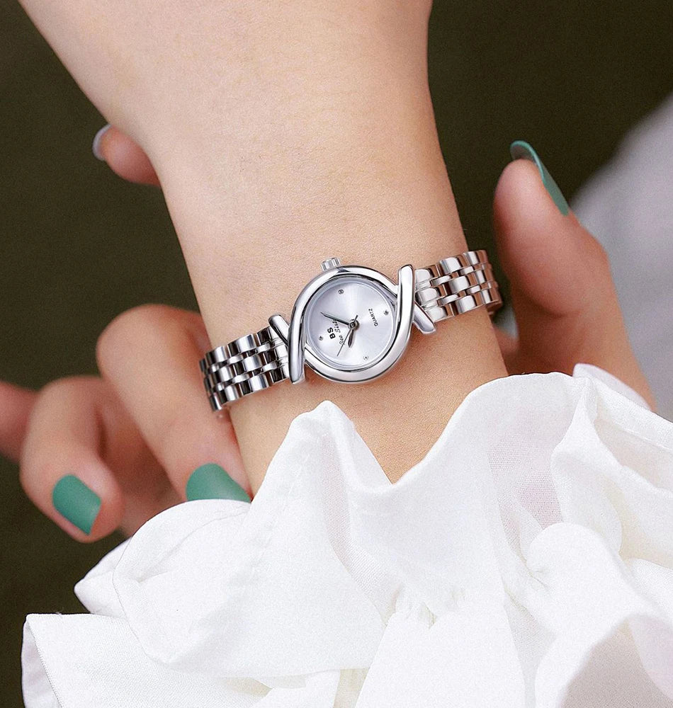 Elegant silver-tone quartz wristwatch for women with a sleek stainless steel link strap and unique circular bezel.