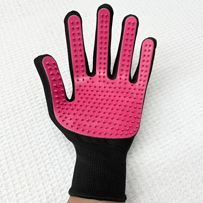 Black and pink pet grooming glove with rubber nodules on the palm for brushing and removing loose fur.