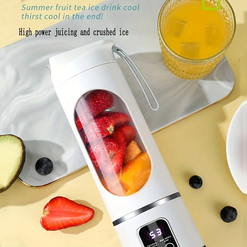 Portable white electric blender bottle with a digital battery display, containing strawberries and mango chunks.