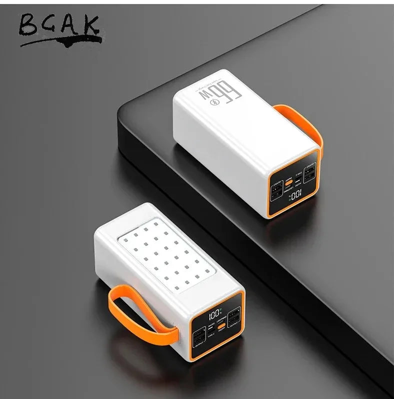 Two white portable power banks with orange carry straps, LED digital displays, and multiple charging ports.