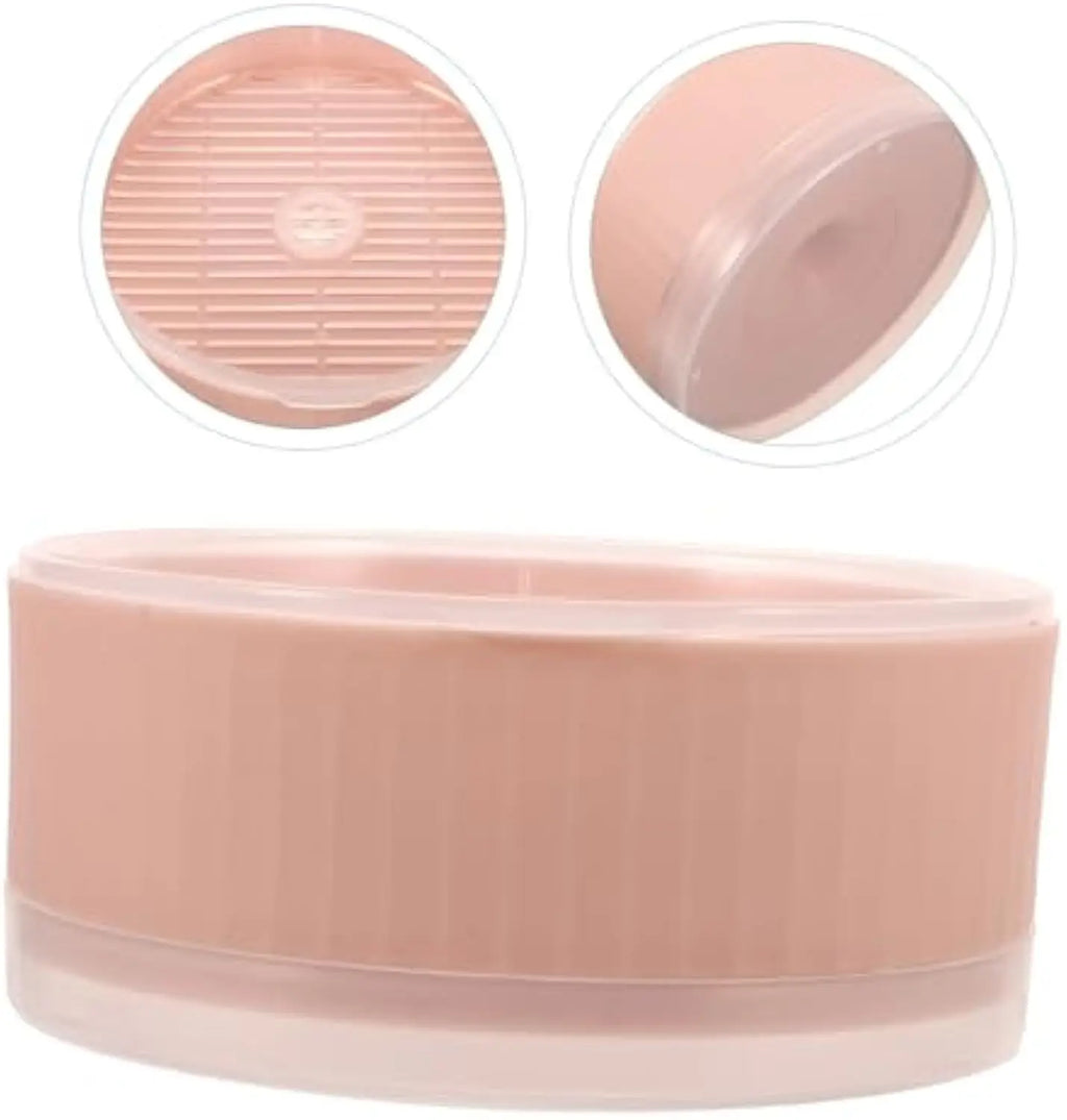 A round, dusty pink plastic cat grass planter, showing the main bowl, inner drainage grate, and clear bottom tray.