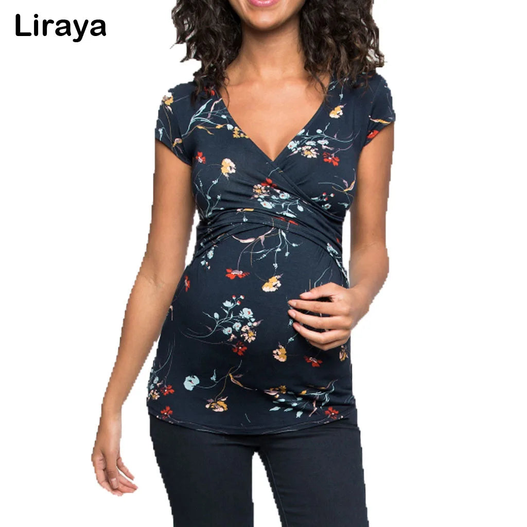 Navy floral maternity top with a V-neck, short sleeves, and a flattering crossover front design.