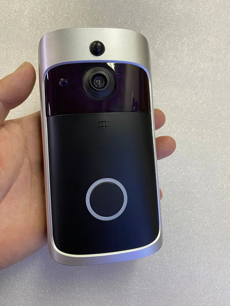 Silver and black smart WiFi video doorbell featuring a wide-angle camera lens and a circular doorbell button.