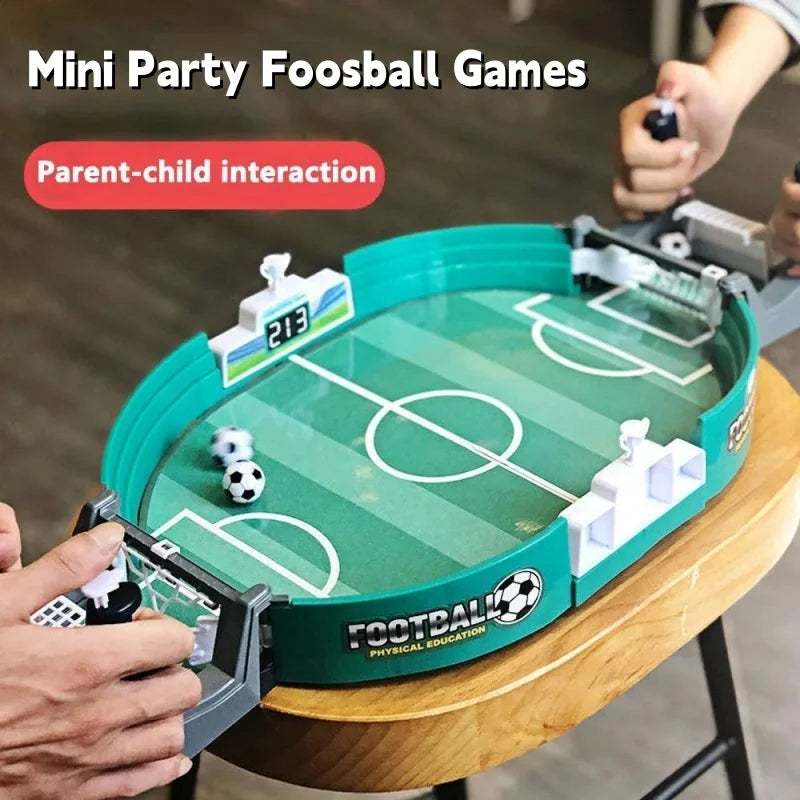 Tabletop mini foosball game with a green pitch, integrated scoreboards, and manual controllers for two players.