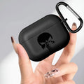 Matte black silicone case for AirPods Pro, featuring a Punisher skull print and a black carabiner clip.