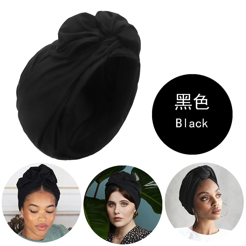 A stylish, solid black French vintage-inspired turban hat featuring a decorative knotted front detail.