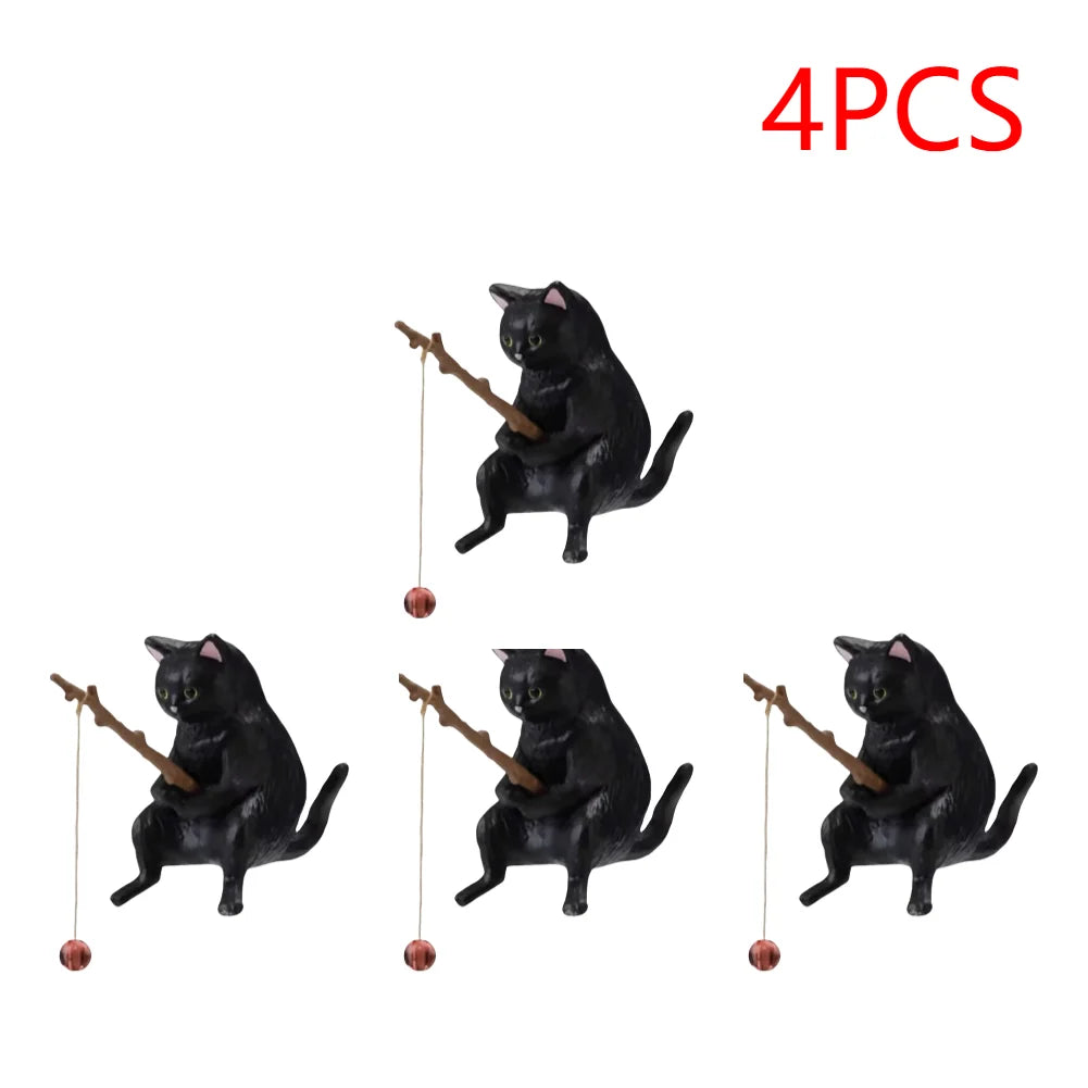 Set of four black cat aquarium ornaments, each holding a small twig fishing rod with a tiny hook.